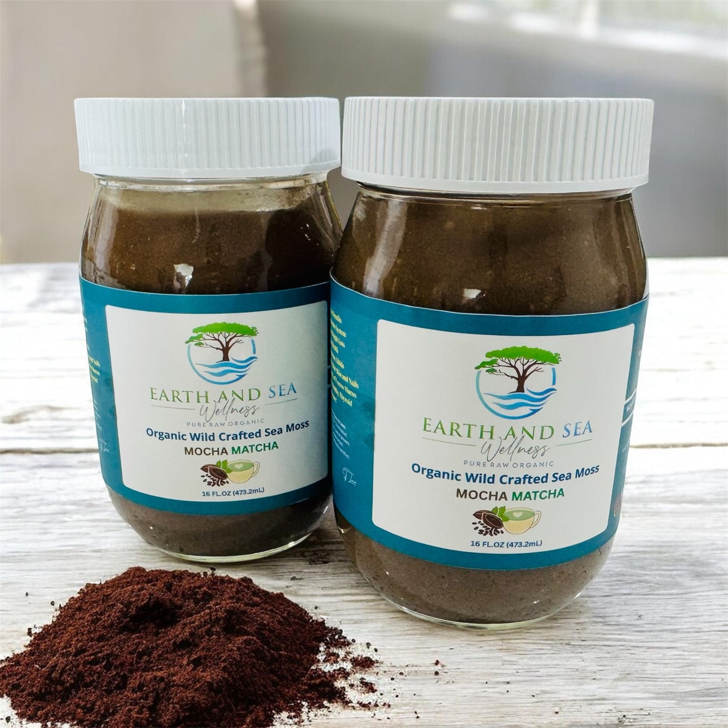 Two jars of Earth and Sea Welness Organic Wild Crafted Sea Moss Mocha Matcha on a wooden surface.